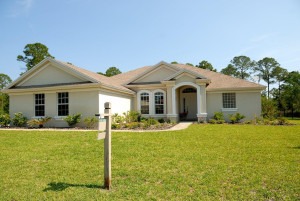 An image of a white and brown home under the blue sky