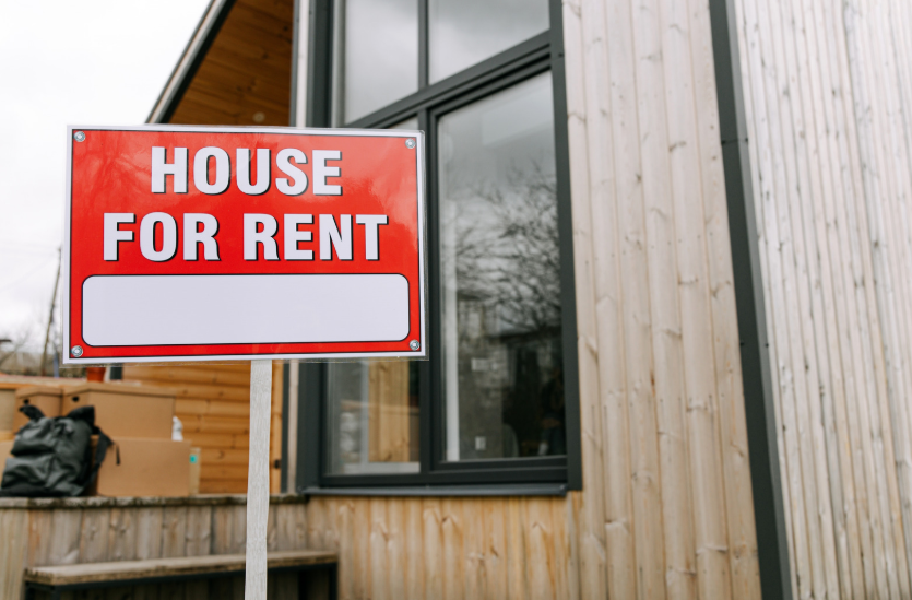 Vacant Colorado house with a For Rent sign, illustrating property qualification using projected rental income for a DSCR loan.