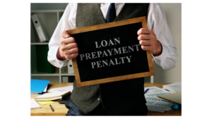 Investor or loan officer holding a small chalkboard sign that reads 'LOAN PREPAYMENT PENALTY'