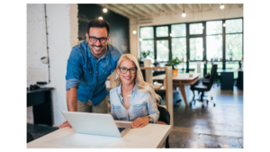 A smiling couple, self-employed business owners, reviewing their options for a Bank Statement Loan, specifically deciding between the 12-month and 24-month bank statement review periods.